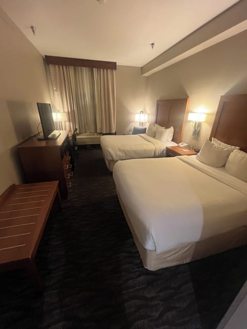 Standard Room, 2 Queen Beds, Non Smoking | Desk, blackout drapes, iron/ironing board, free cribs/infant beds