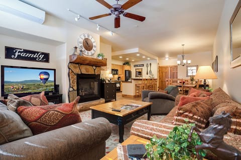 Sink into plush sofas by the fireplace, where cozy touches and mountain views welcome your group. You'll find ample space to unwind, dine, and gather as family.