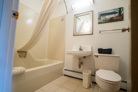 Standard Room, 2 Queen Beds, Non Smoking | Bathroom | Combined shower/tub, free toiletries, towels, soap