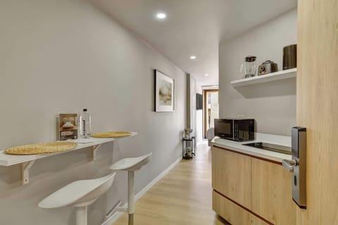 Bright dining and kitchen area with modern finishes.