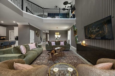 Open concept living, dining and kitchen with plenty of seating and ROKU Smart TV