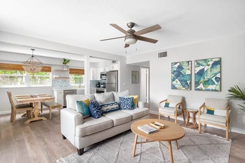 Open concept living space with tropical view of Florida Seagrapes.