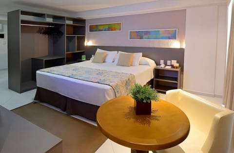 Unwind in a plush king bed with soft ambient lighting.