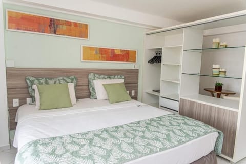 Settle in with crisp linens and generous open wardrobe storage.
