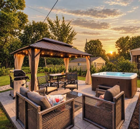 Welcome to the Indy Retreat! Enjoy the large private backyard with a hot tub, firepit, gazebo dining area, grill, and multiple lounge spaces