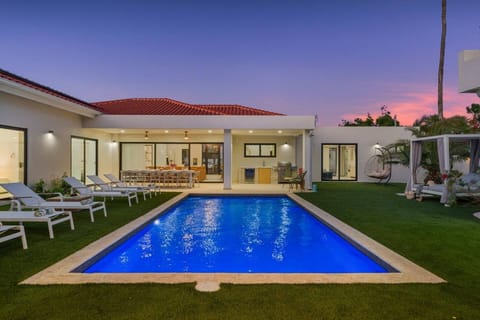 Enjoy endless relaxation by the stunning pool, where warm sunsets and tropical scenery create your own private paradise