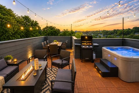 Enjoy the rooftop's beautiful sunset in the hot tub, around the firepit, grilling, or enjoying outdoor dining