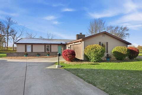Skip the parking hassle with a massive private driveway that easily fits multiple vehicles at this quiet Indiana country property.