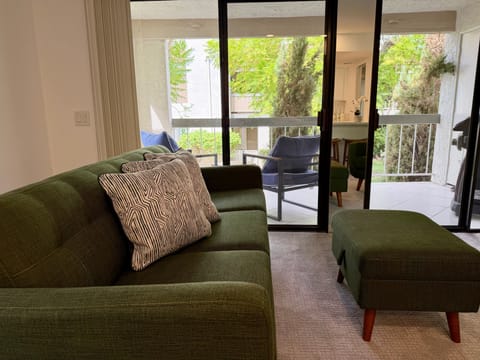 Bright living room with direct access to the private balcony