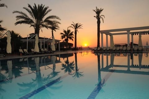Indoor pool, outdoor pool, pool umbrellas, sun loungers