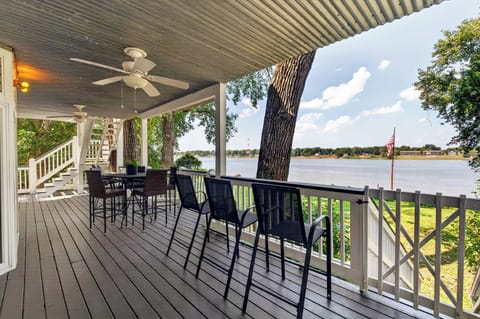 Deck: Scenic waterfront deck with a peaceful atmosphere and beautiful water views, creating a great spot to gather, relax, and enjoy the outdoors throughout your stay.