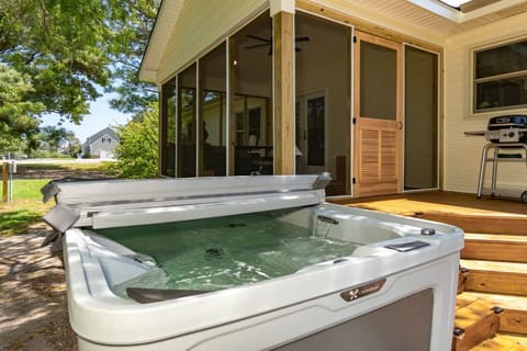 The backyard centerpiece — your private hot tub, steps from the screened porch. This is where every Beaufort evening winds down