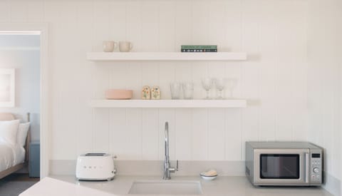 Suite, 2 Bedrooms (Balboa) | Private kitchenette | Fridge, eco-friendly cleaning products