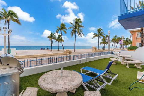 Lounge the day away or dine alfresco with ocean views in the shared yard​
