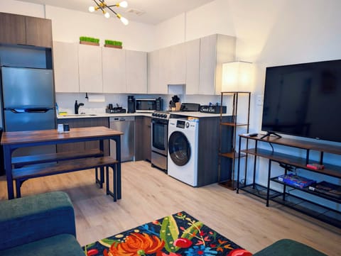 Modern studio with full kitchen, in-unit laundry, and smart, stylish design