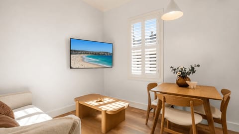Comfortable lounge with TV and dining space to unwind.