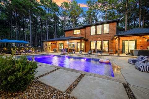 Private pool, spacious patio, covered outdoor living, and a beautiful wooded setting make it perfect for group getaways.