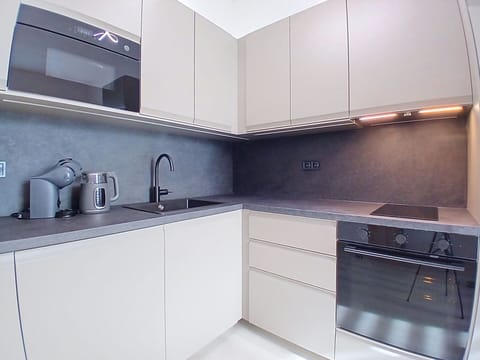 Kitchen, Countertop, Cabinetry, Kitchen Appliance, Wood, Interior Design, Flooring, Major Appliance, Plumbing Fixture, Home Appliance