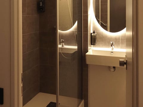 Down comforters, desk, blackout drapes, iron/ironing board