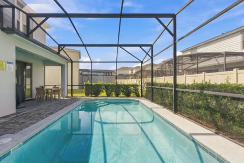 Private screened pool with sun loungers – your own backyard oasis