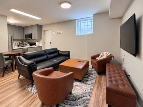 Watch movies easily on a massive, wall-mounted living room smart TV.