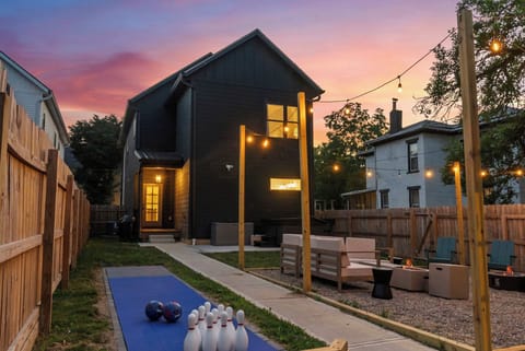 Twilight backyard with string lights and cozy seating