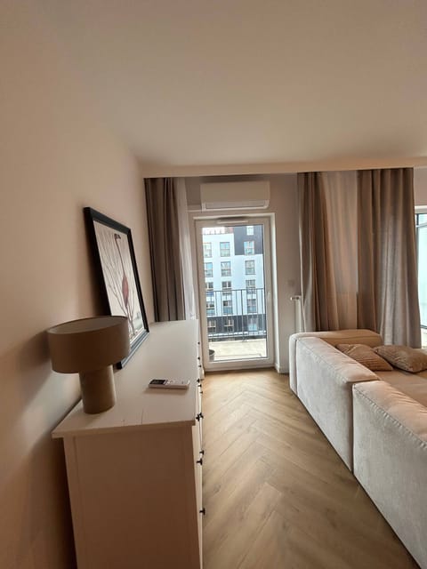 Family Apartment, Balcony, Courtyard View | Living area | 42-inch flat-screen TV with cable channels, Netflix, streaming services