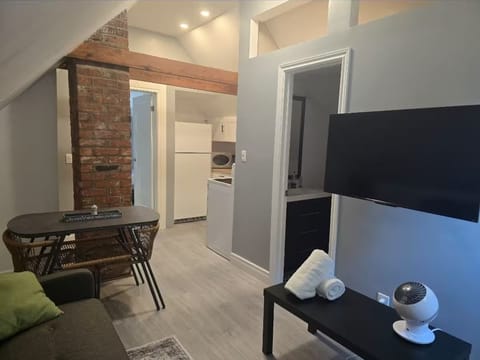 Living room: 50 inch mounted TV & a Luxury sofa for comfort - Converts into bed