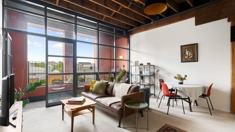 Airy, industrial-chic open living space