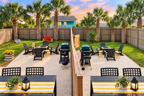Book both sides of The Yellow Retreat and enjoy two fenced yards connected by a gate, two covered dining patios, fire pits, electric and charcoal BBQs, cornhole, and giant four-in-a-row. Stay together with the comfort of two separate homes
