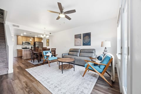 Living room with flat screen tv, dining room and kitchen beyond