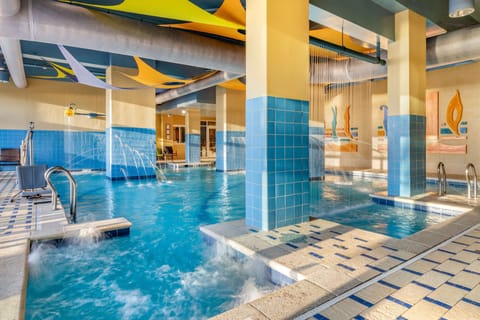 2 indoor pools, outdoor pool, open 8:00 AM to 10:00 PM, pool umbrellas