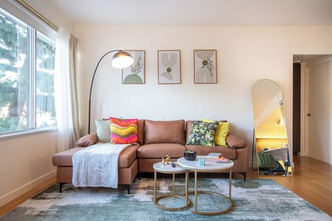 Welcome to our cozy living room, designed for ultimate relaxation and comfort. Sink into our plush sofa, surrounded by stylish decor that exudes warmth and charm. Unwind in front of the flat-screen TV