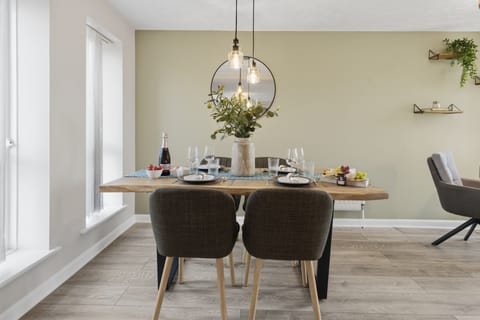 Bright modern dining area set for four with stylish, welcoming decor