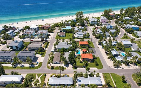Aerial view of a tropical beach neighborhood just steps from the sand