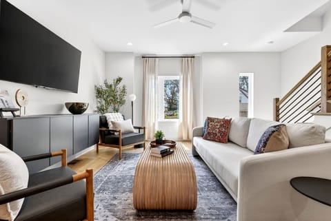 Bright and inviting living room, featuring a comfortable sofa bed and a Smart TV with access to all your favorite streaming services.