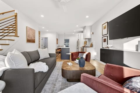 Bright and inviting living room, featuring a comfortable sofa bed and a Smart TV with access to all your favorite streaming services.