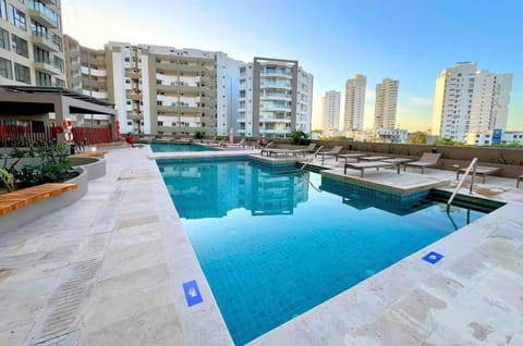 Pool deck with loungers at golden hour