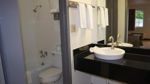 Combined shower/tub, towels, soap, shampoo