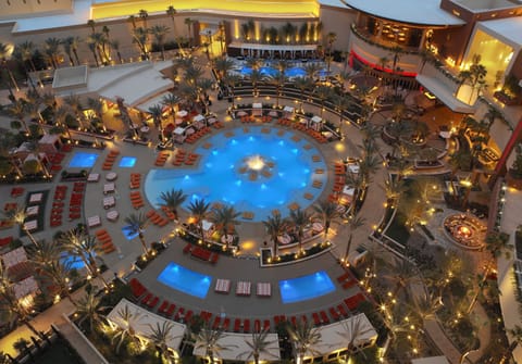 Outdoor pool, open 9 AM to 6 PM, cabanas (surcharge), pool umbrellas