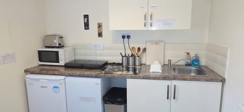 Mini-fridge, microwave, stovetop, coffee/tea maker