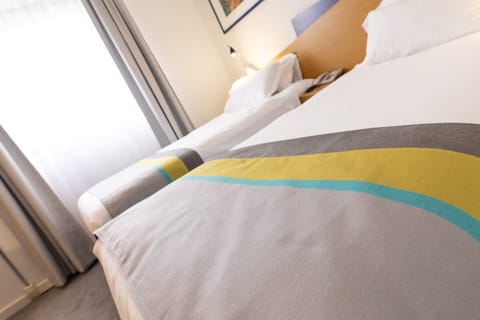 Desk, iron/ironing board, free cribs/infant beds, free rollaway beds