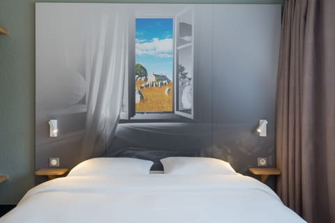 Premium bedding, desk, laptop workspace, blackout drapes