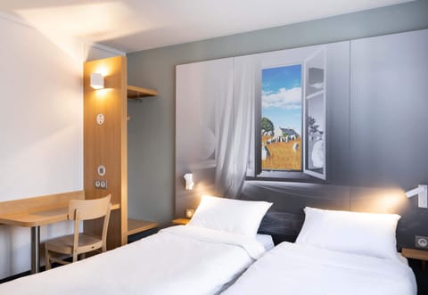 Premium bedding, desk, laptop workspace, blackout drapes