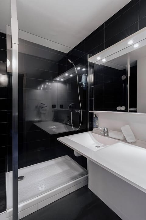 Shower, hair dryer, slippers, towels