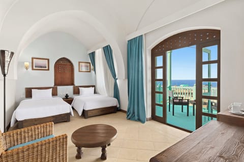 Room, 2 Twin Beds, Sea View | Minibar, in-room safe, desk, laptop workspace