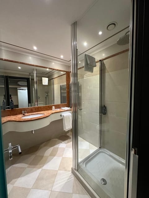 Shower, free toiletries, hair dryer, slippers