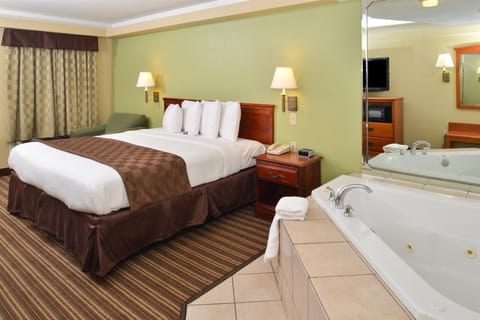 Room, 1 King Bed, Jetted Tub | Desk, iron/ironing board, free WiFi, alarm clocks