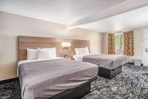 Desk, laptop workspace, blackout drapes, iron/ironing board