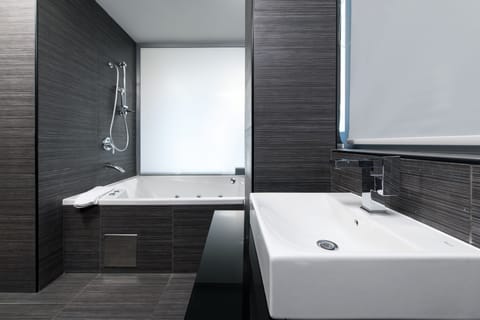 Deluxe Suite, Sea View | Bathroom | Eco-friendly toiletries, hair dryer, towels, soap